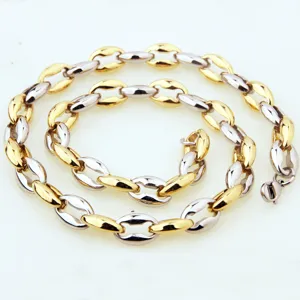 Detailed close-up view of the two-tone coffee bean chain necklace, stylish stainless steel link design.