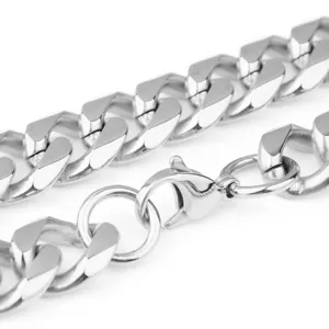 Close up detail of silver stainless steel cuban link chain for men, thick hip hop necklace.
