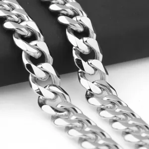 Close-up detail of stainless steel silver Cuban link chain, showing polished surface.