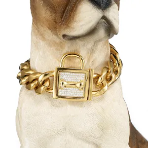 Close-up detail of 19mm gold Cuban link pet dog collar with rhinestone lock bone pendant.