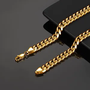 Men gold Cuban link chain detail, high polished stainless steel thick necklace closeup view