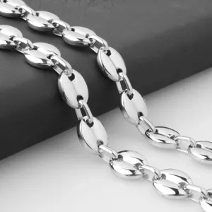 Close-up view of the polished stainless steel coffee bean link chain necklace detail.