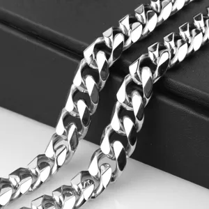 Detailed shot of heavy stainless steel cuban chain necklace, silver hip hop style mens jewelry.