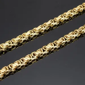 Gold stainless steel Byzantine chain necklace for men, thick hip-hop neck jewelry detail.