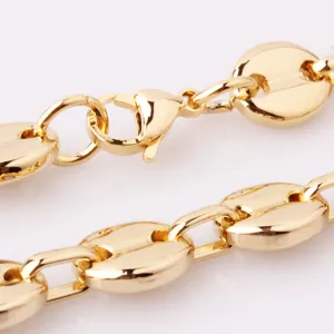 Gold stainless steel coffee bean chain necklace close-up, glossy metal texture and link detail.