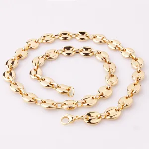Close-up detail of the gold-plated stainless steel coffee bean chain necklace link texture.