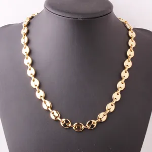 Detailed close-up of gold stainless steel coffee bean link chain necklace, hip hop style jewelry.