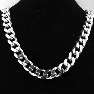 Stainless steel chunky Cuban link chain detail, heavy silver tone men hip hop jewelry piece.