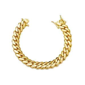 Detailed view of a gold plated stainless steel cuban link bracelet, hip hop style jewelry.