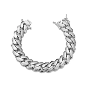 Close-up of stainless steel Cuban link bracelet, polished silver finish, hip hop jewelry detail.