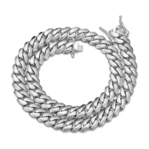 Detail view of men silver stainless steel cuban link chain necklace with polished finish.