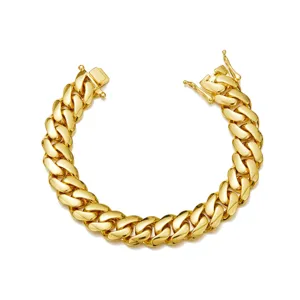 Gold cuban link bracelet detail, 18k gold plated stainless steel hip hop chain close up.