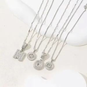 Detailed view of exquisite cubic zirconia letter pendant necklaces, elegant clavicle chain design.
