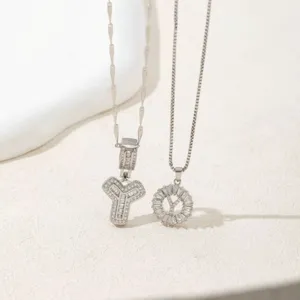 Detail shot of double silver pendant necklaces featuring sparkling cubic zirconia crystals.