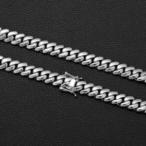 Close-up detail of stainless steel silver cuban link chain necklace for men jewelry.