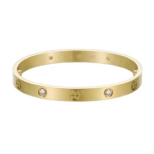 Detailed view of a gold-plated stainless steel diamond bangle bracelet with classic screws.