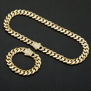 Detailed view of a gold-plated hip-hop cuban link chain and matching bracelet set.