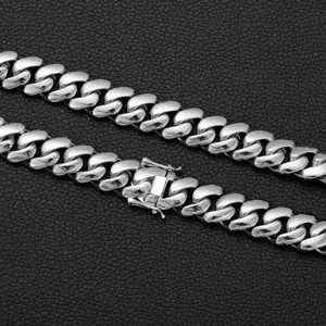 Stainless steel Cuban link chain close-up detail showcasing polished silver finish.