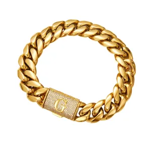 Detailed view of the men gold Cuban link chain necklace with paved initial letter G clasp.