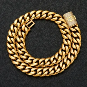 Detailed view of the men's hip hop gold Cuban link chain with a paved diamond initial G lock.