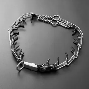 Stainless steel dog prong training collar detail, featuring secure quick-release buckle and tips.