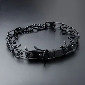 Black stainless steel dog prong training collar with durable buckle and leather reinforcement.