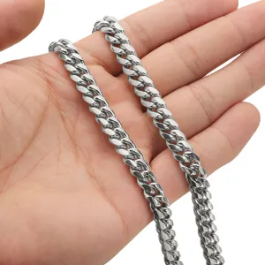 Detailed view of men's stainless steel Cuban link chain necklace with polished silver finish.