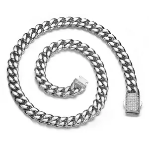 Close-up detail of a silver stainless steel men cuban link chain with paved rhinestone clasp.