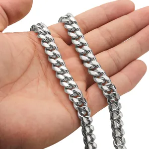 Stainless steel Cuban link chain for men, heavy silver metal hip hop necklace detail.