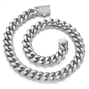 Close-up of men's stainless steel Cuban chain necklace with pave diamond clasp design.