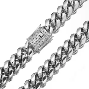 Detailed shot of heavy stainless steel Cuban chain necklace with micro-paved cubic zirconia clasp.