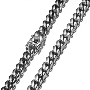 Stainless steel Cuban link chain necklace for men, hip hop silver jewelry close-up detail.