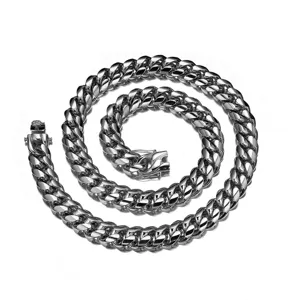 Close-up detail of the stainless steel Cuban link chain showing the intricate dragon head clasp.