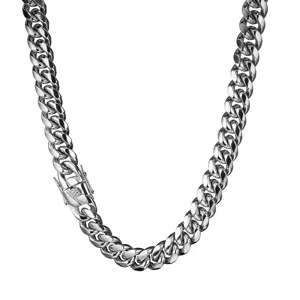 Closeup of stainless steel Cuban chain necklace, heavy metallic link details and sturdy clasp.