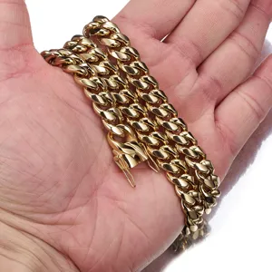 Gold Cuban link chain detail shot, hip hop style titanium steel necklace with bright finish.
