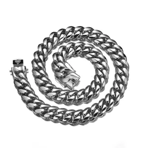 Detailed view of stainless steel Cuban link chain necklace with dragon clasp hip hop jewelry.