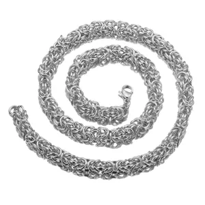 Detail view of stainless steel Byzantine chain link, highlighting intricate metal weave and clasp.