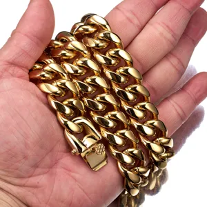 Gold Cuban link chain hip hop titanium steel necklace detail shot showcasing metallic luster.