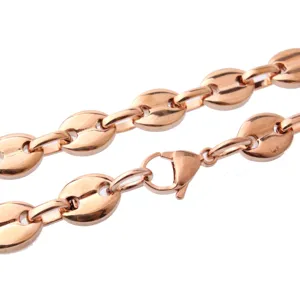 Close-up detail of rose gold stainless steel coffee bean chain necklace link with lobster clasp.