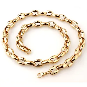 Close-up view of a gold stainless steel pig nose chain link detail, polished finish.
