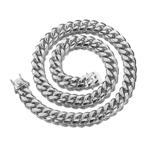 Close-up detail of the heavy stainless steel Cuban link chain and secure box clasp design.