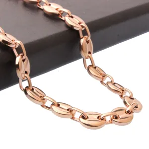 Close-up detail of rose gold coffee bean chain necklace showing polished metal links.