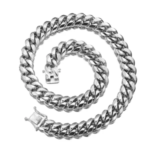 Stainless steel Cuban link chain detail, heavy hip-hop necklace with secure box clasp.