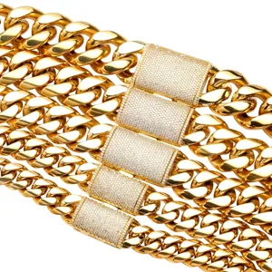 Close up of iced out gold cuban link chain clasp with sparkling micro pave cubic zirconia stones.