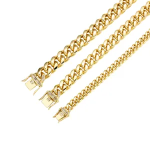Gold Cuban link chain for men, hip hop stainless steel necklace with sparkling cubic zirconia clasp.