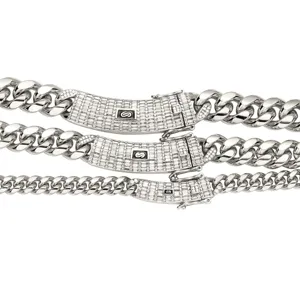 Stainless steel cuban chain necklace detail featuring iced out zirconia lock clasp.