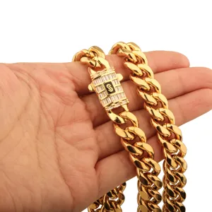 Collier de chaine cubaine en acier inoxydable dore pour homme avec fermoir en cristal