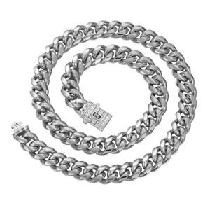 Men's stainless steel Cuban link chain necklace detail view featuring paved zirconia box clasp.