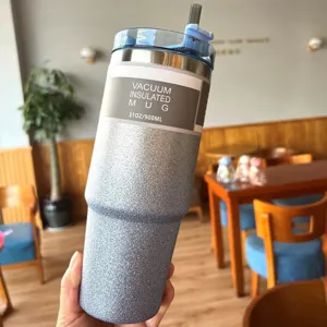 Detail of a 30oz glitter finish stainless steel vacuum insulated mug with straw.