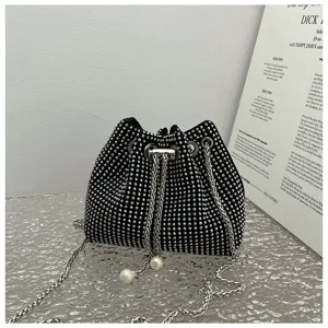 Close-up detail of a shiny black rhinestone drawstring bucket bag with elegant pearl charms